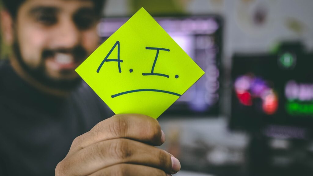 A person holding a note that says A.I., representing AI in Google search