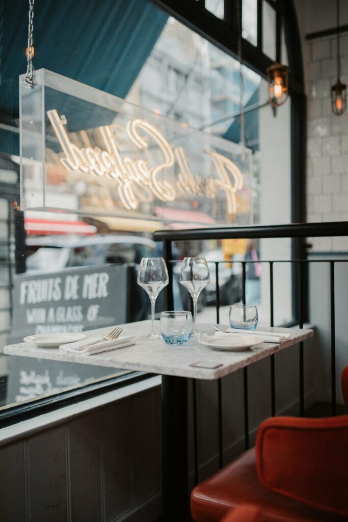 A set restaurant table with wine glasses ready for guests, representing tables filled through local restaurant SEO